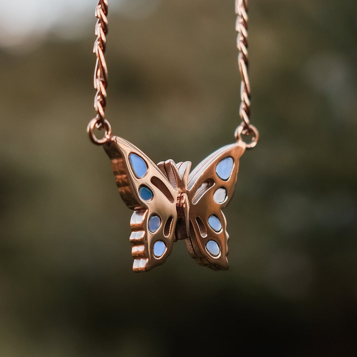 "Fritillary Necklace", a delicate butterfly necklace in rose gold with nacre accents.