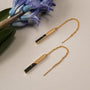 "Campania Earrings: Elegant marble and gold earrings with a sleek, modern design."