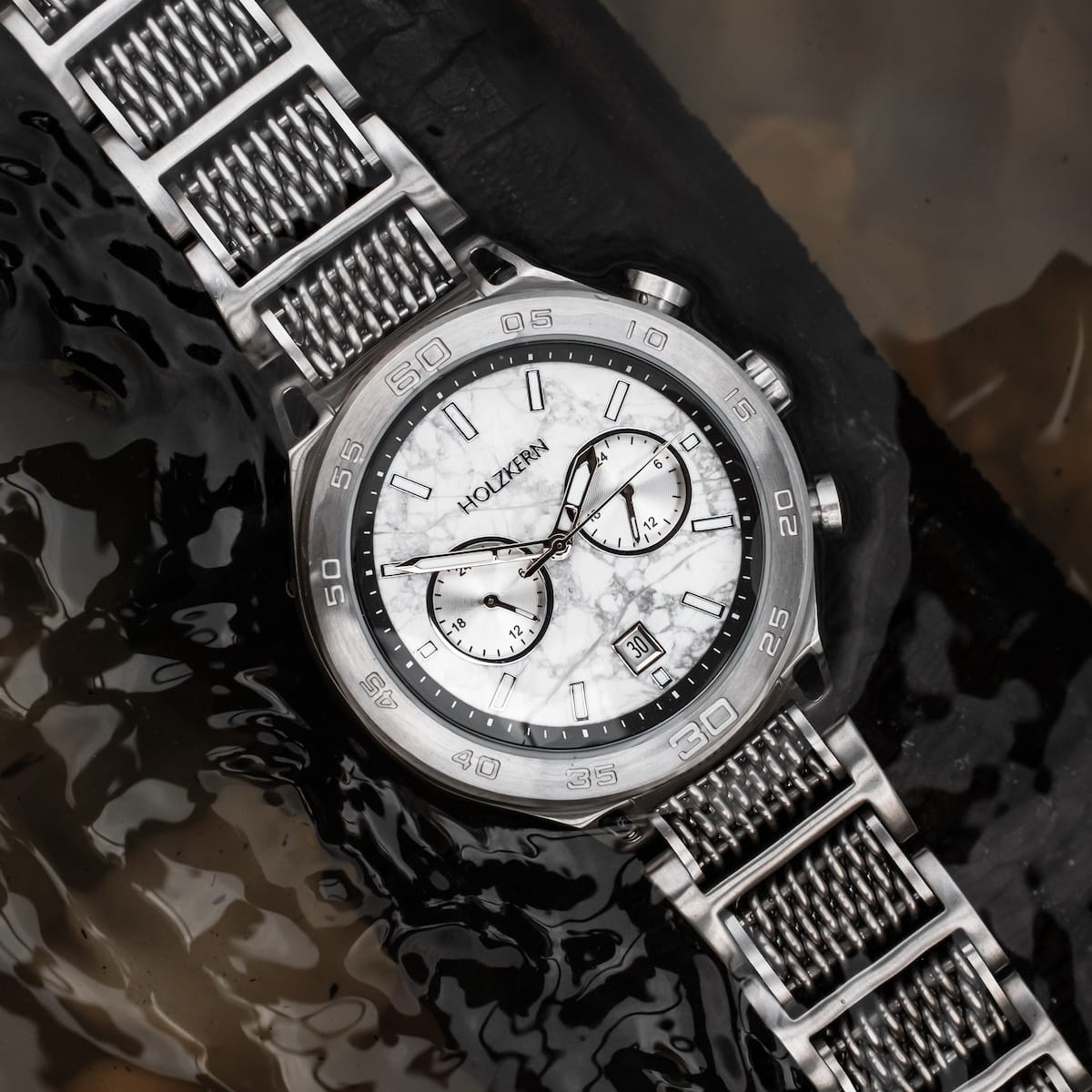"Elqui" watch featuring a marble dial and silver accents with a sophisticated, contemporary style.