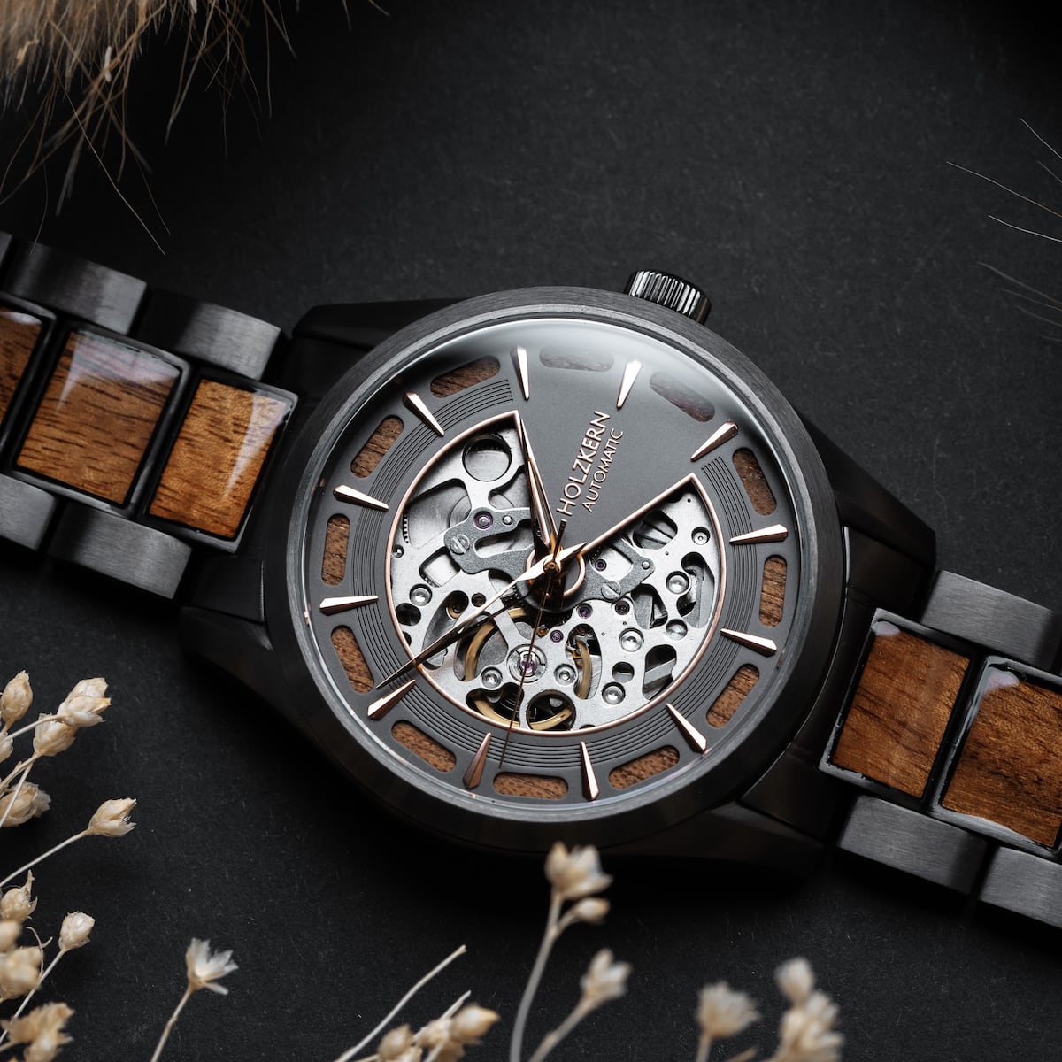 "Tenoumer" watch featuring a Koa wood and dark grey design with a detailed skeleton dial.