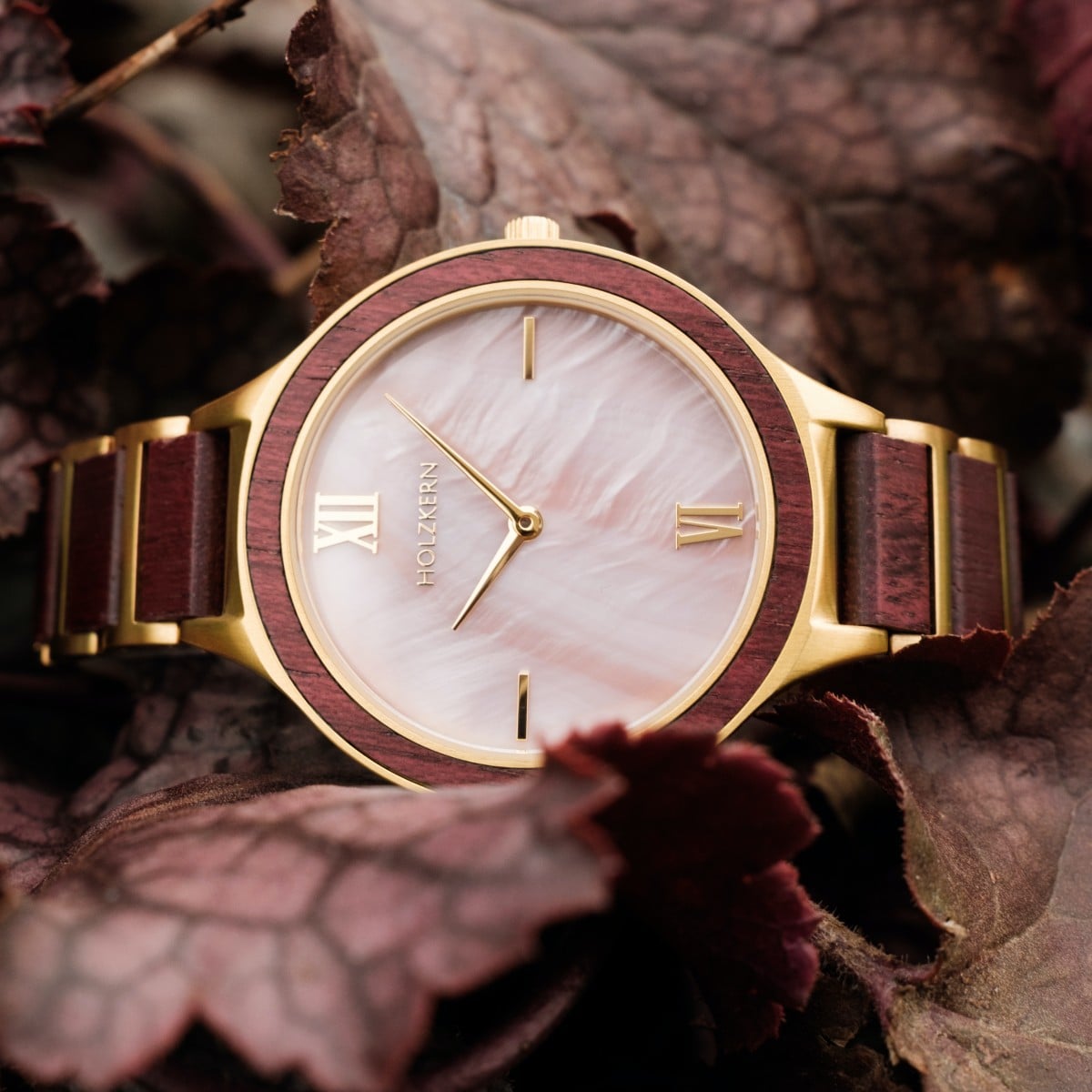 "Mauritius" watch featuring amaranth wood and nacre accents in an elegant design.