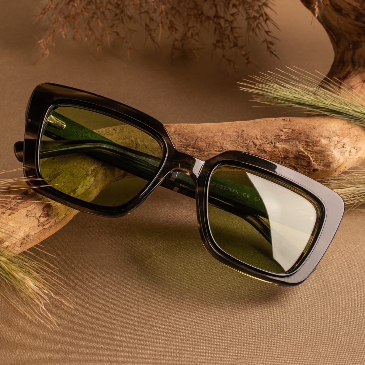 "The Exquisite sunglasses featuring a Leadwood and Khaki Dust design in a stylish aviator frame."