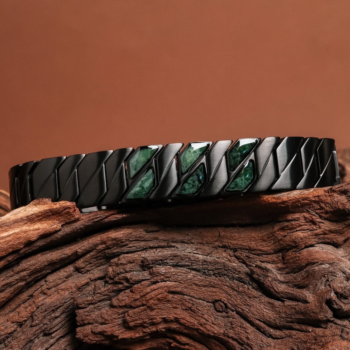 "Baritone" bracelet in sleek black with marble accents, featuring a modern, geometric design.