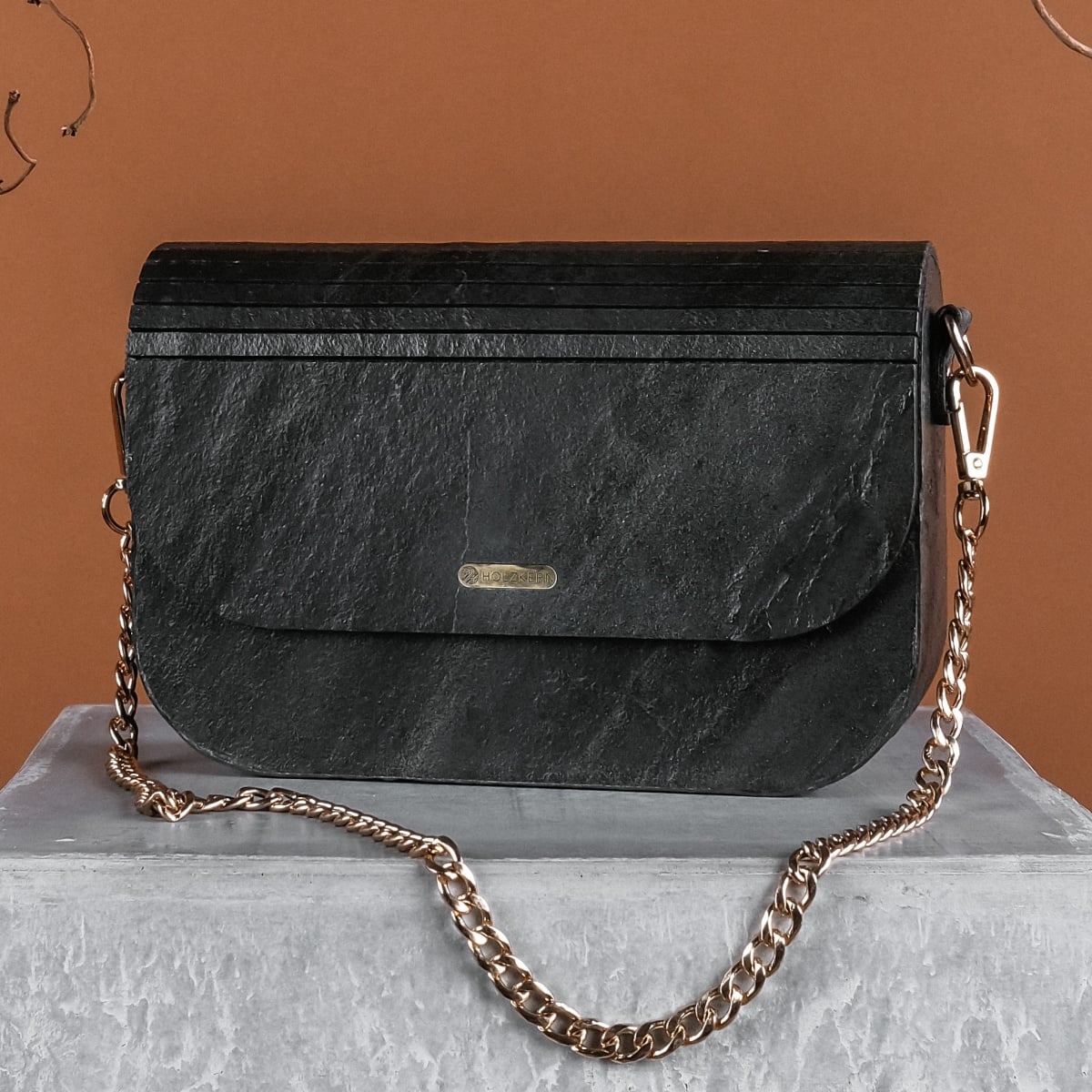 "Iveya VEGAN Black Slate vegan handbag with a black slate look and gold chain strap."