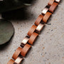 "Rondo" bracelet with cherry and rose gold links in a natural, elegant style.
