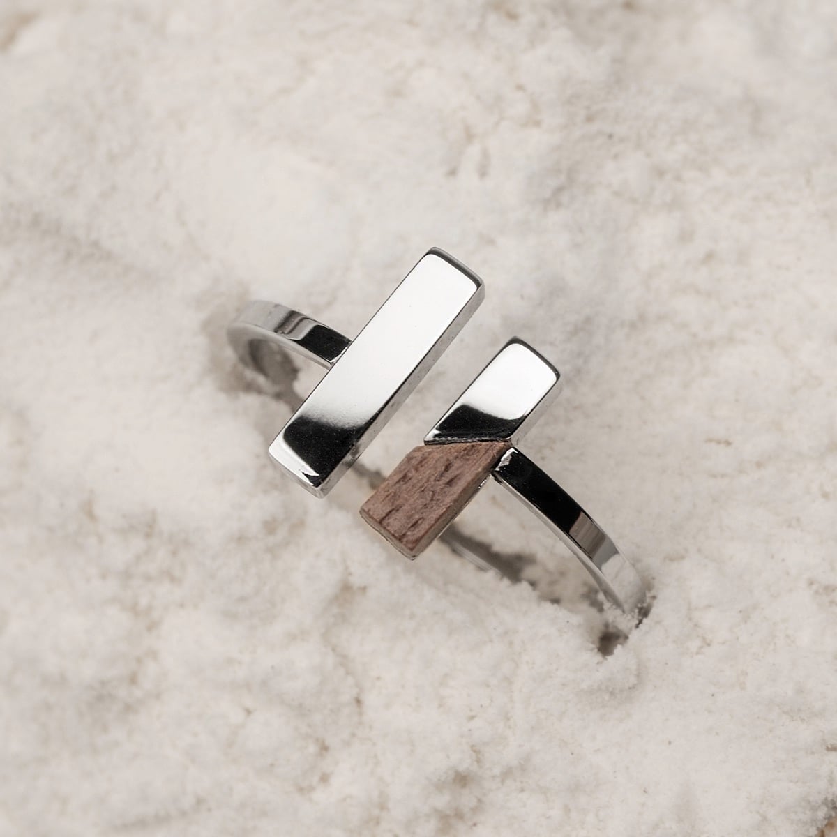 "Campania Ring" - A modern ring with walnut and silver accents in a minimalist design.
