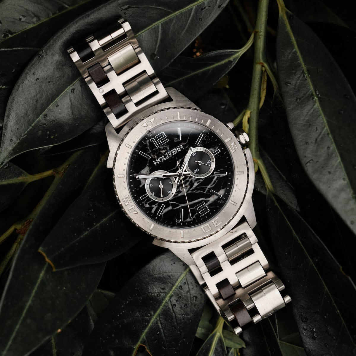 "Norium watch, featuring a marble dial and silver accents with a sophisticated, modern design."