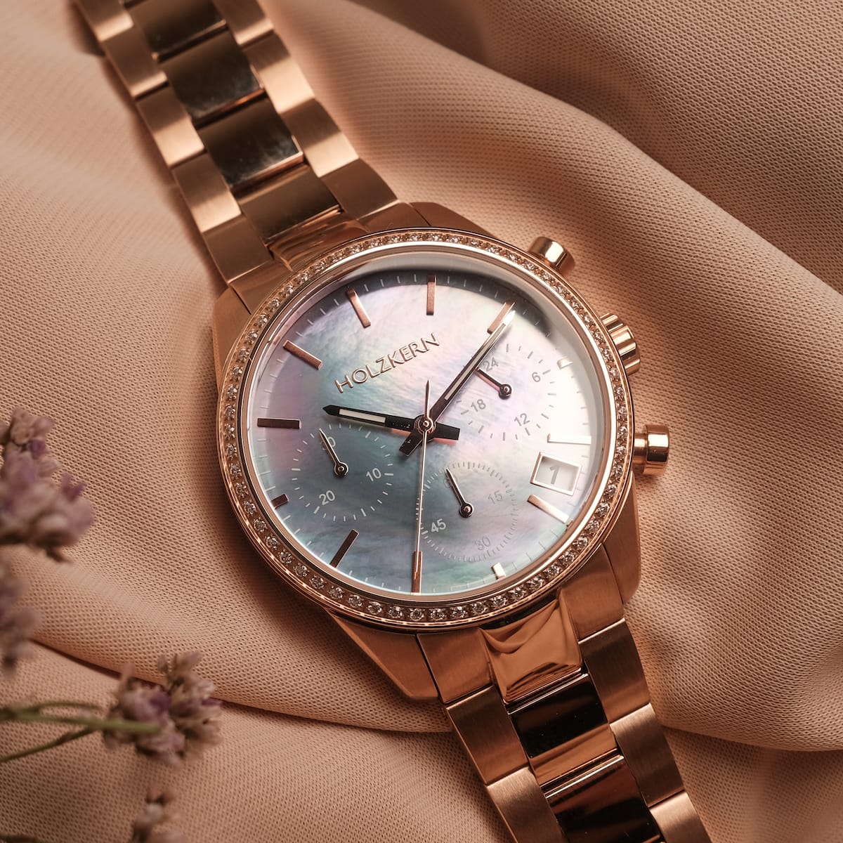 "The Passionate watch with rose gold strap and nacre dial, elegant and sophisticated design."