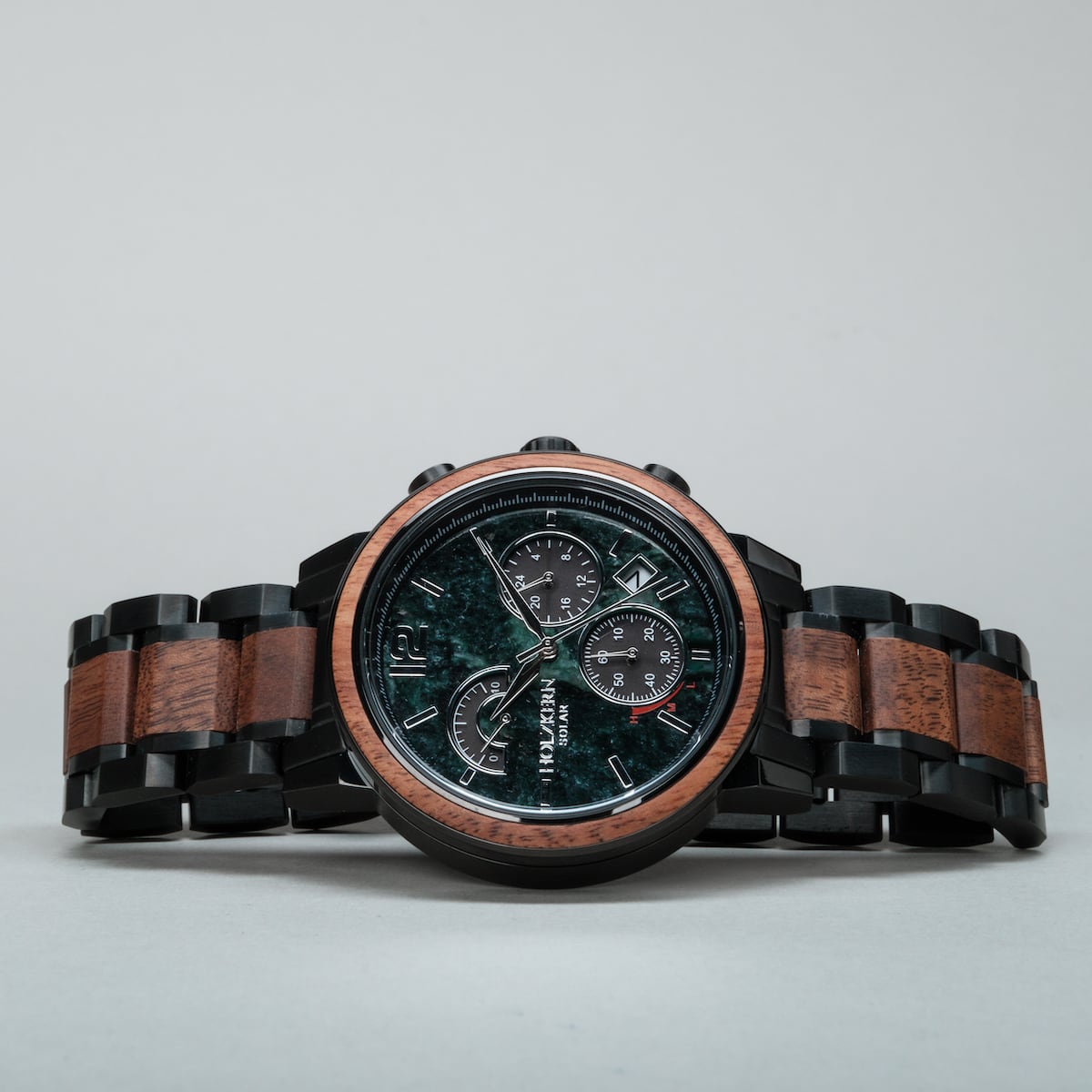 "Scattered" watch with marble face and koa wood accents, featuring a sleek and sophisticated design.