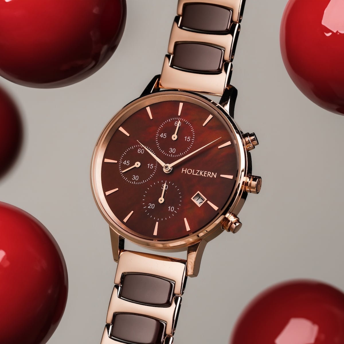 "Cheery" watch with a sleek, modern design featuring nacre and ceramic elements against a chic backdrop.