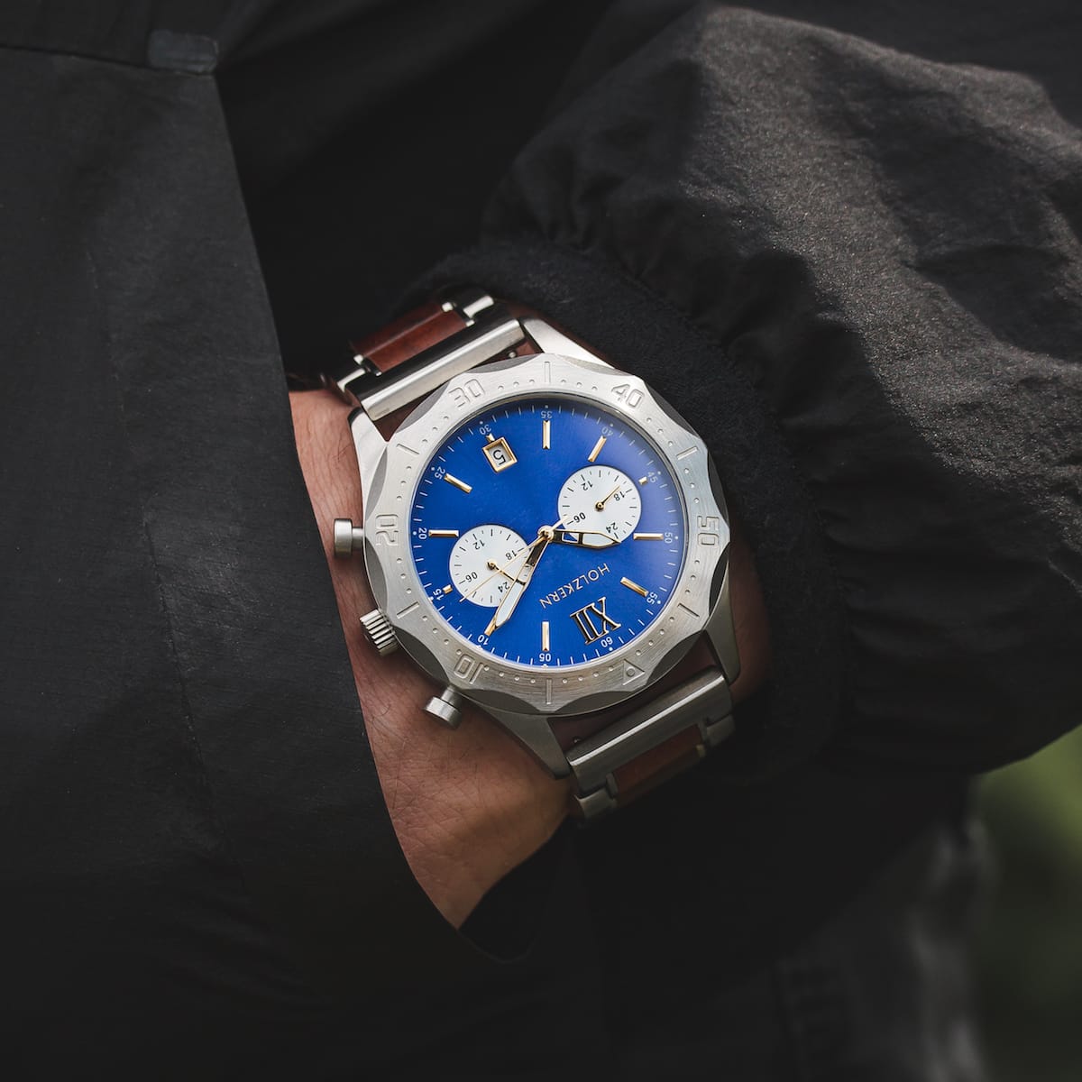 "Osprey wristwatch with a striking azure blue dial and silver casing, offering a bold and sophisticated style."