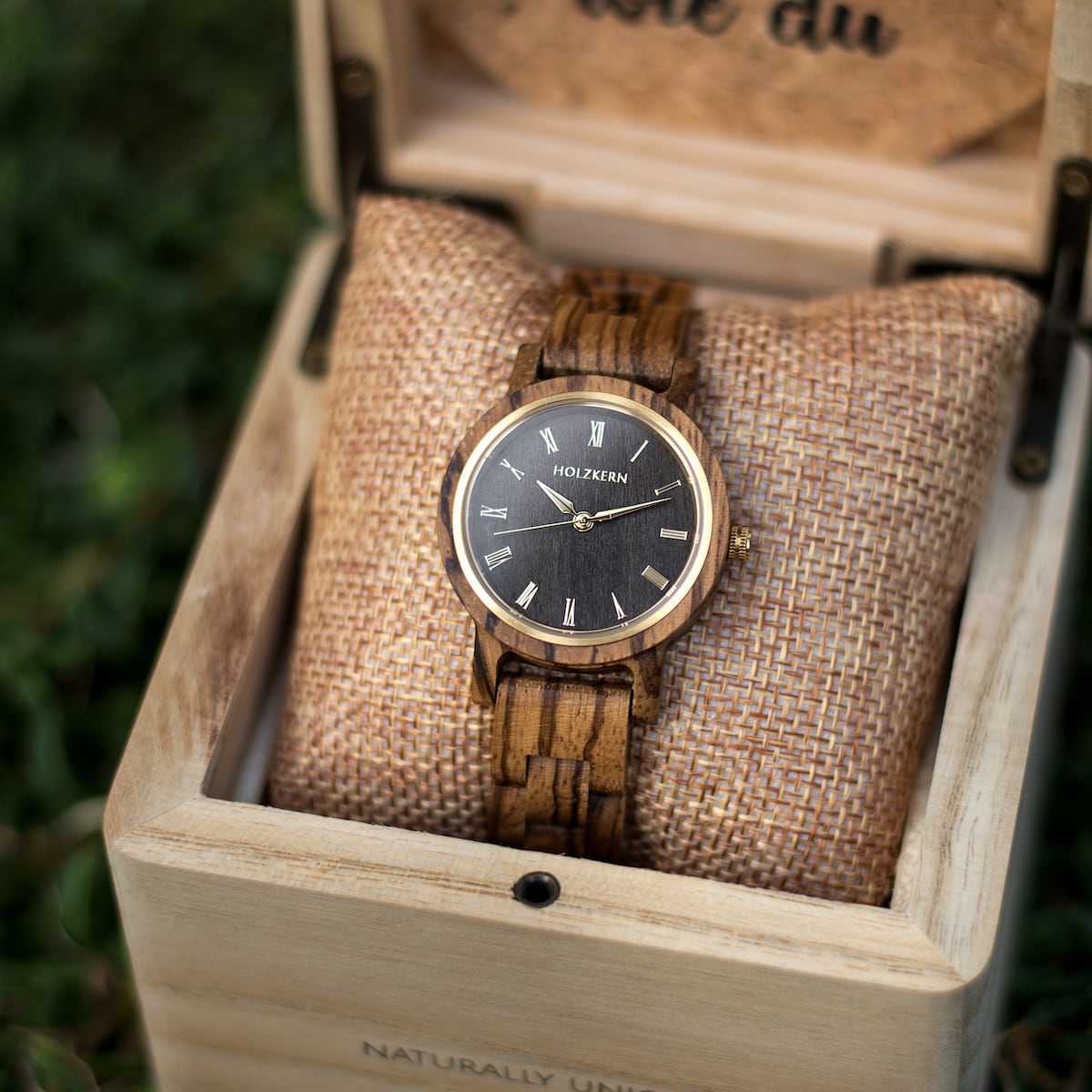 "Earth" watch, crafted from zebrawood and maple, featuring a natural wooden design in an elegant display box.