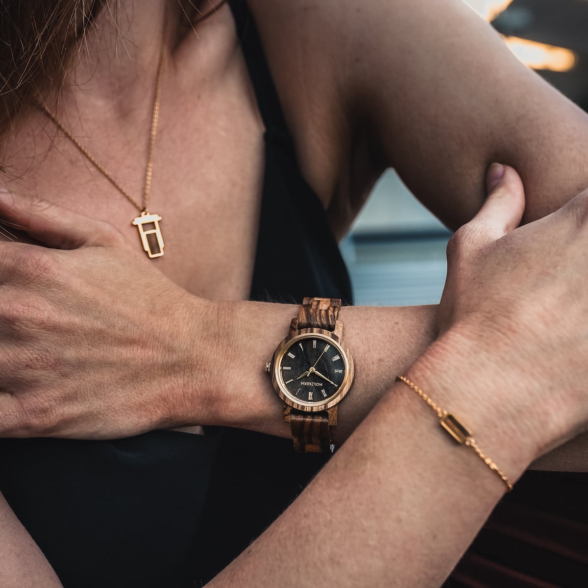 "Earth" watch featuring a zebrawood and maple design, showcasing natural elegance and modern style.