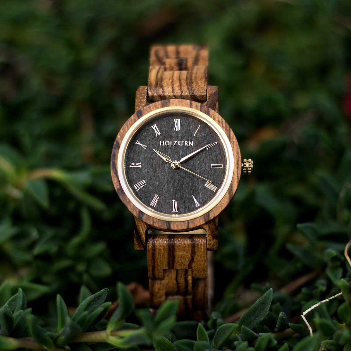 "Earth" is a stylish watch featuring zebrawood and maple elements with a modern, natural design.
