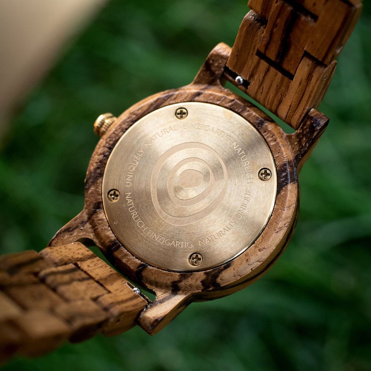 "Earth" wooden wristwatch featuring zebrawood and maple with a natural, earthy aesthetic.