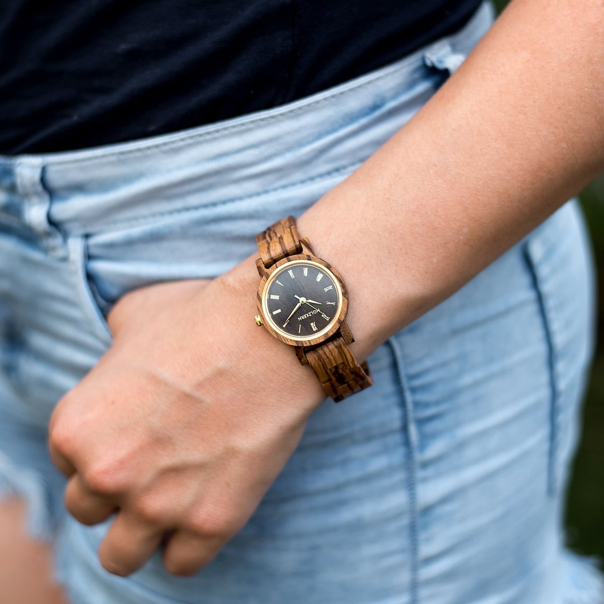 "Earth" watch featuring a zebrawood and maple design, exuding a natural and elegant look.