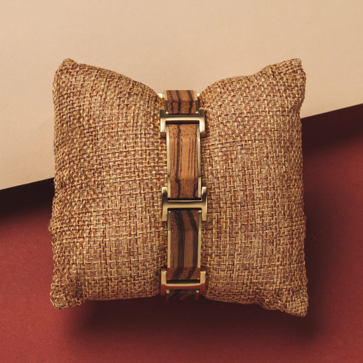 "Acapella" bracelet features a zebrawood and gold design with an elegant, natural style.