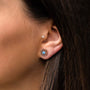 "Composition Earrings" earrings feature a rose gold design with blue nacre detailing, showcasing elegance and style.