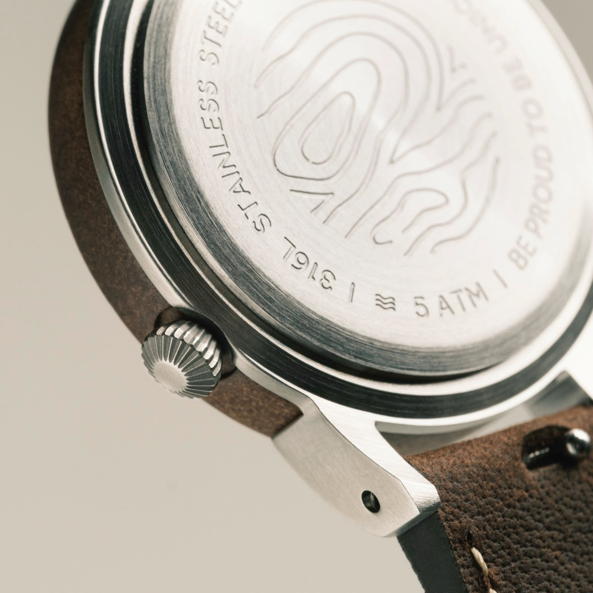 "Côte d’Azur" watch, featuring a walnut and nacre style with a stainless steel case and leather strap.