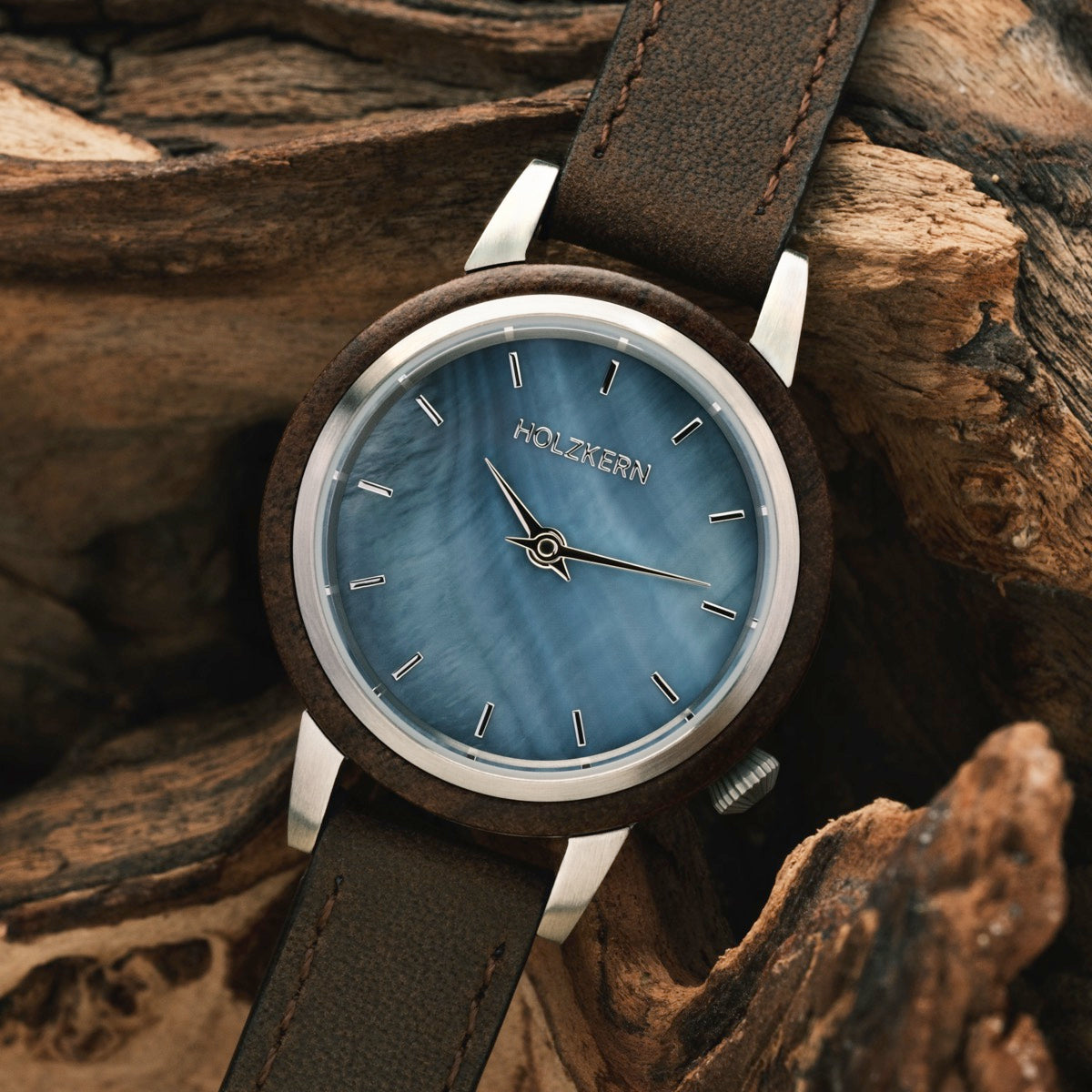 "Côte d’Azur" watch with walnut casing and nacre dial, rustic and elegant aesthetic.
