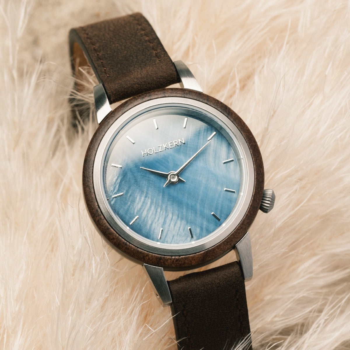 "Côte d’Azur" watch featuring walnut wood and nacre accents with a stylish, natural aesthetic.