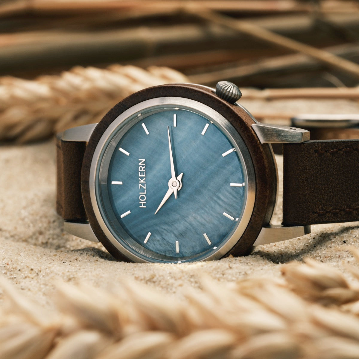 "Côte d’Azur" watch featuring a walnut case and nacre face, showcasing a stylish coastal design.
