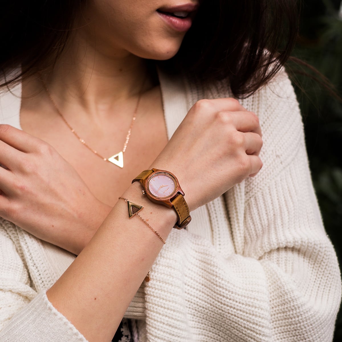 "Cinque Terre watch showcases a cherrywood finish with nacre accents, offering a stylish and elegant look."