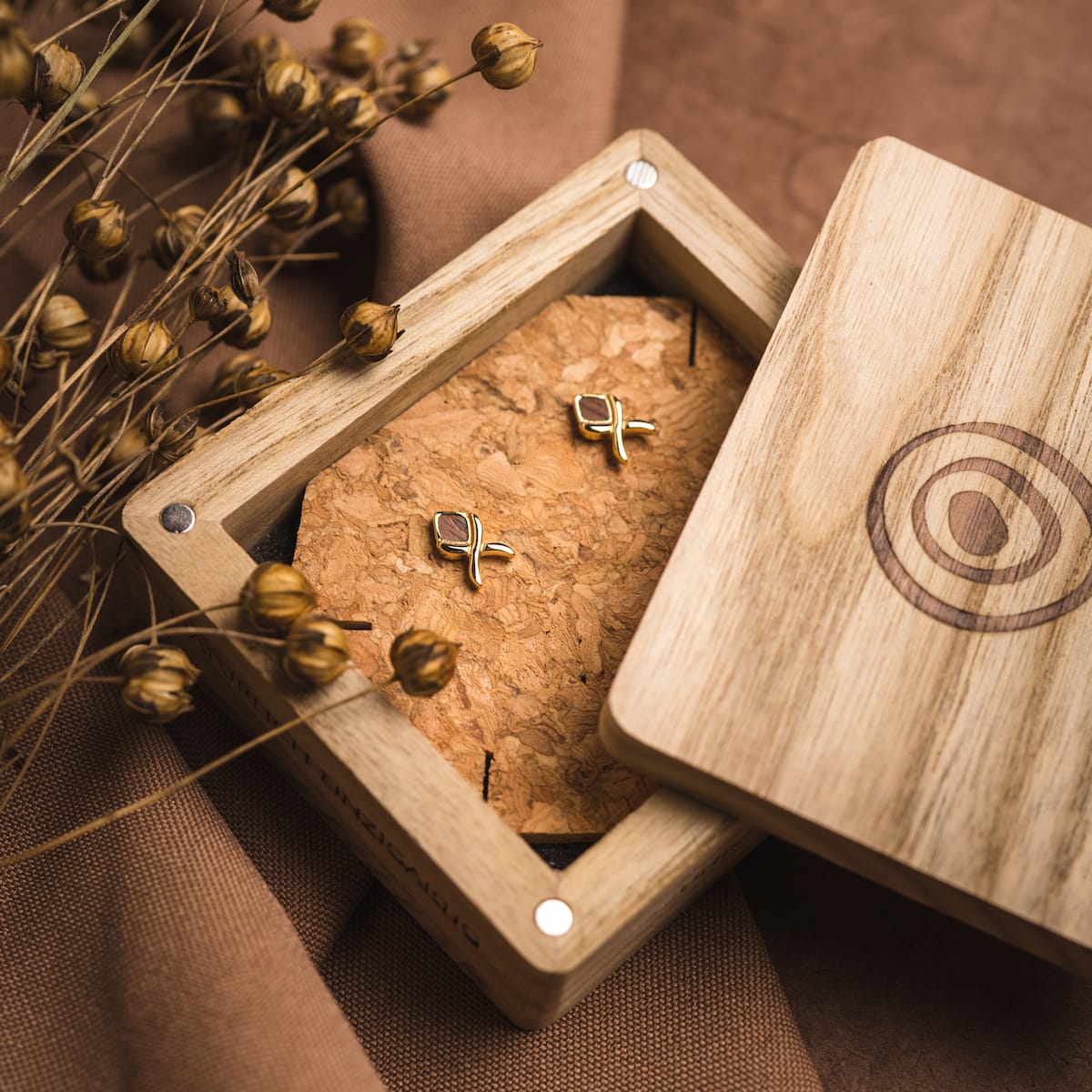 "Mosaic Earrings", stylish walnut and gold earrings, displayed in an elegant wooden box.