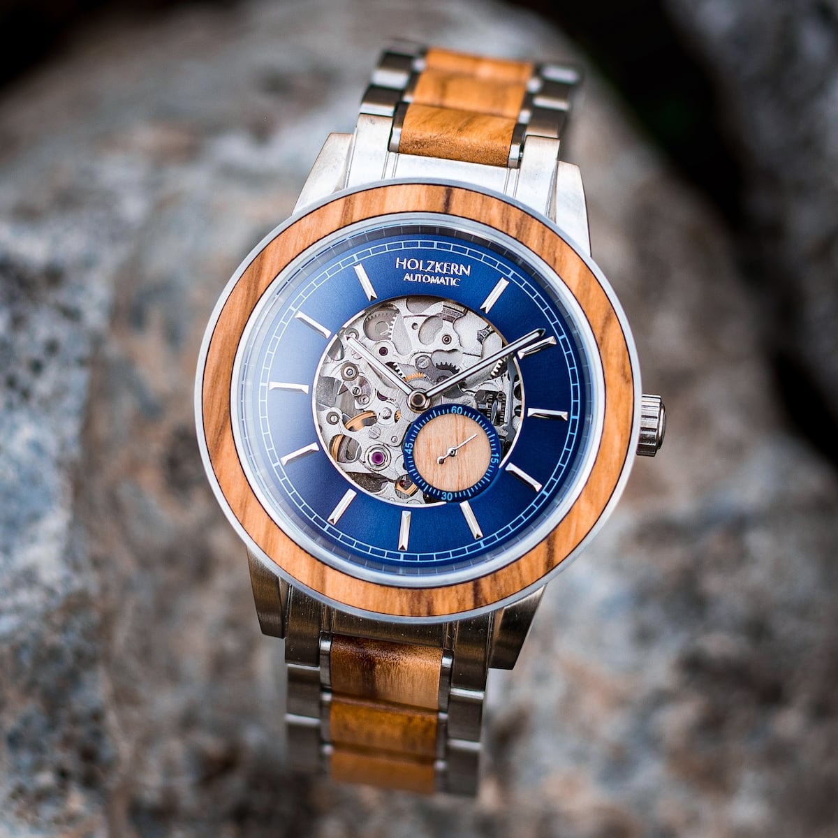 "Haiku" watch featuring a wooden and metal design with a blue skeleton dial.