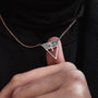 "Chiaroscuro Necklace necklace featuring a gray marble and rose gold triangle pendant style."