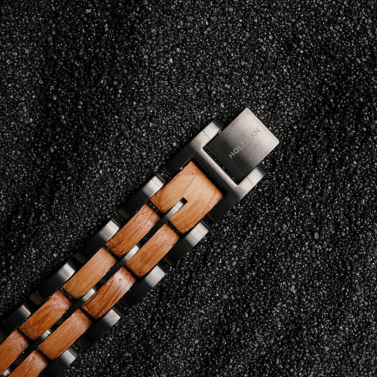 "Kanon", a stylish watch with oak and grey accents on a textured background.
