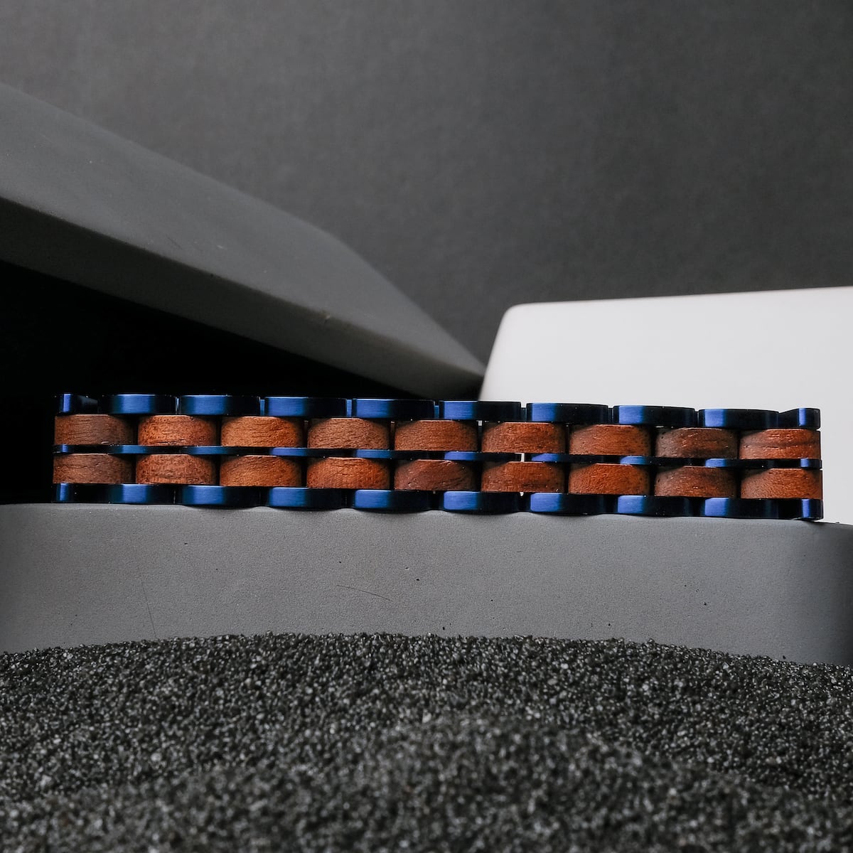 "Kanon" bracelet featuring a walnut and blue design with a modern style.