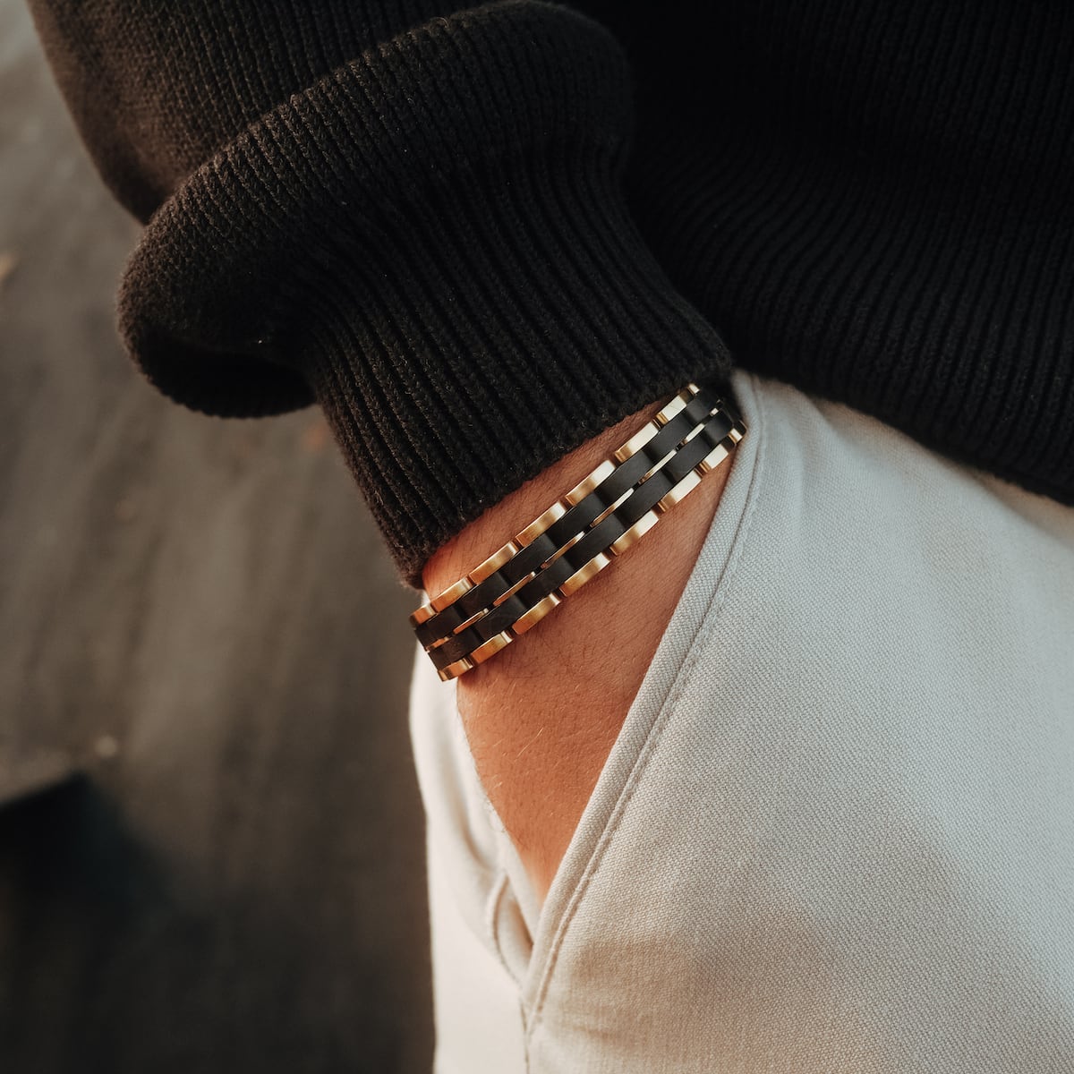 "Kanon" bracelet in a sleek black maple and gold style, offering modern elegance.