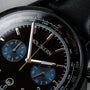 "Rackets, a sophisticated watch featuring a black dial and intricate detail."