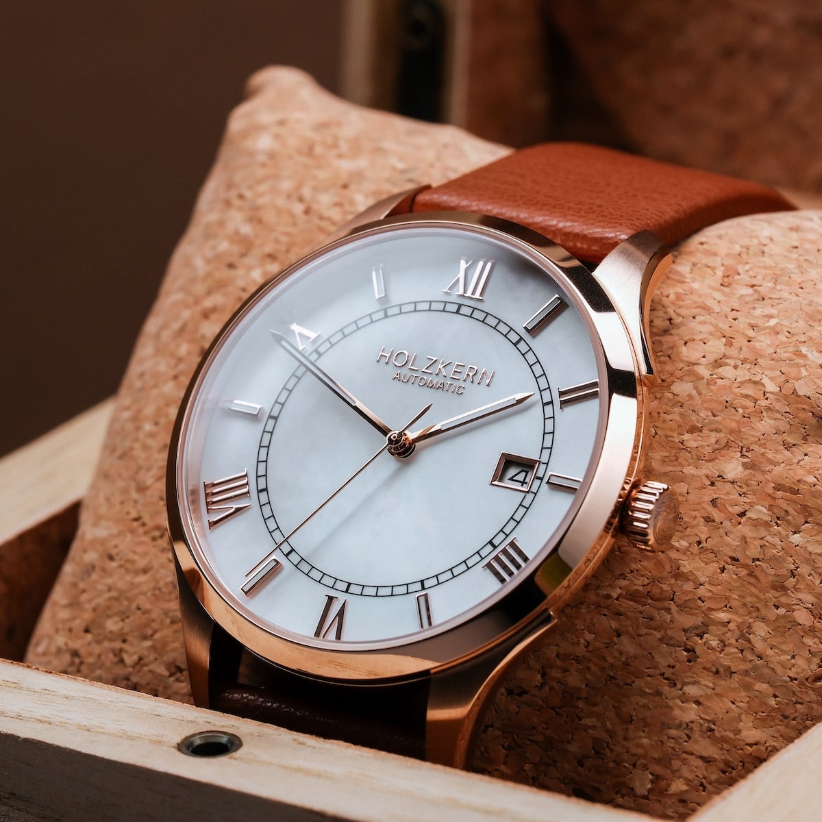 "Milestones" watch features a nacre dial with brown accents and a classic elegant style.