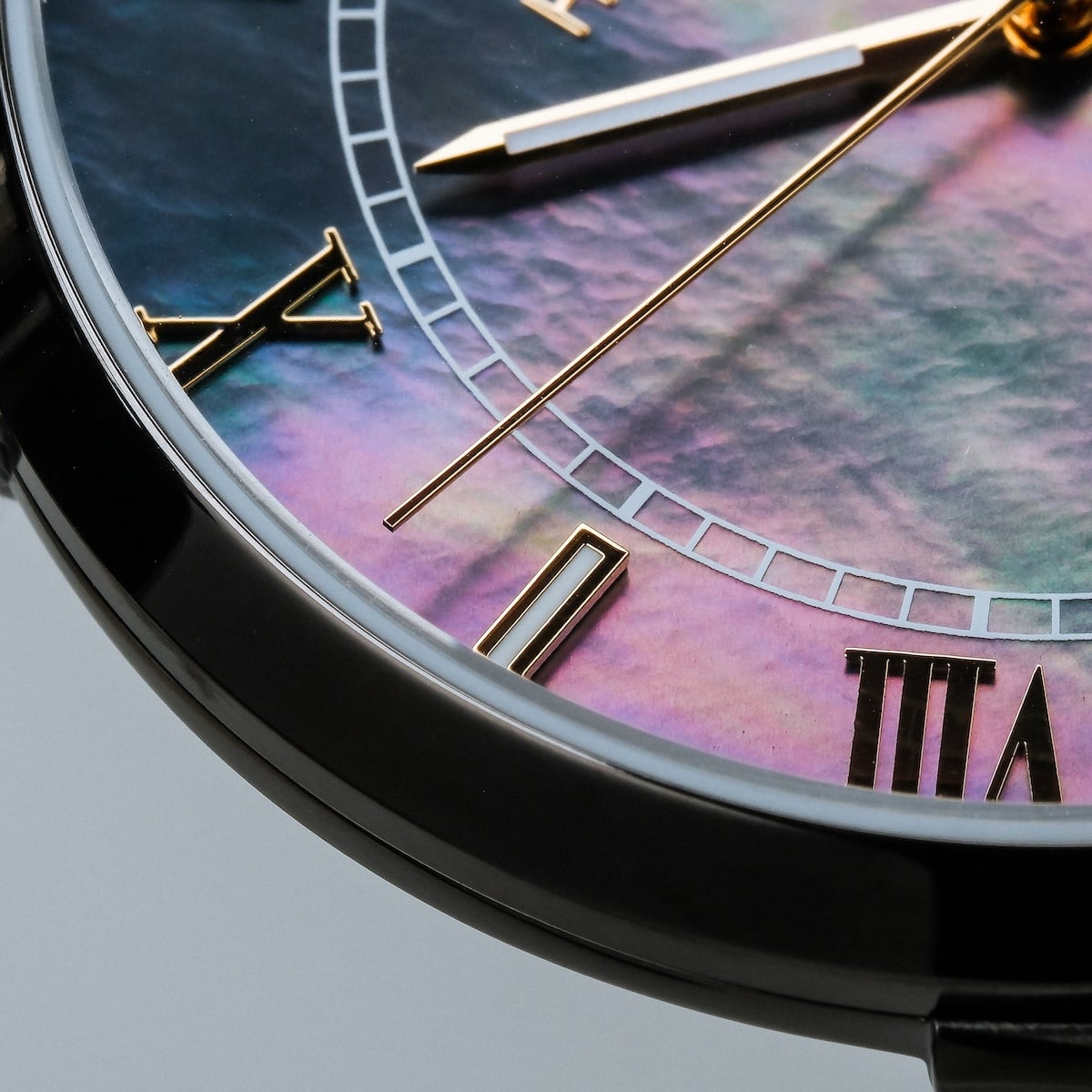 "Milestones" watch featuring a nacre dial and dark gray accents, showcasing elegant design and style.