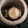 "Laura" watch featuring zebrawood and oak accents with a sleek, elegant design.