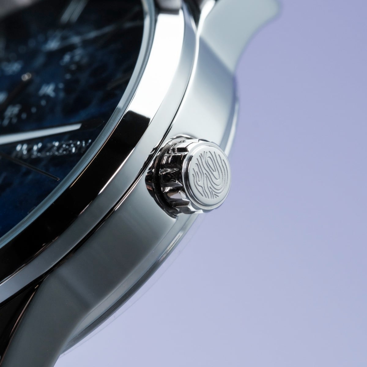 "Gifted" watch with a stylish sodalite and dark brown design, featuring a sleek metallic finish.