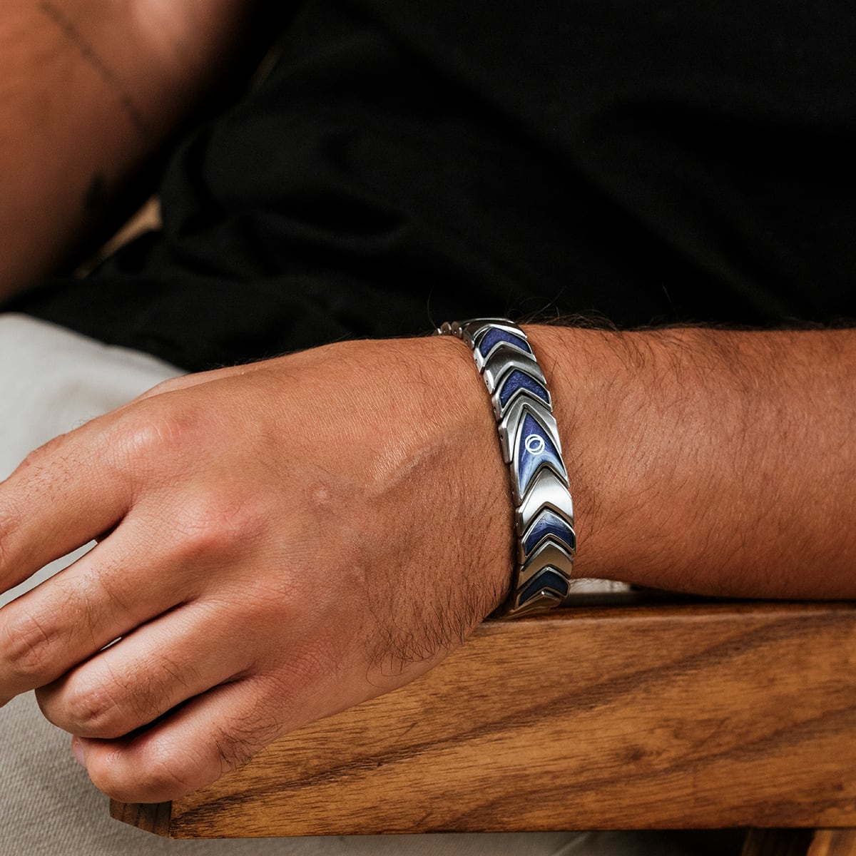 "Sciences" bracelet featuring aventurine and silver with a sleek, modern design worn on a wrist.