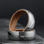 "Sumo Ring", a stylish ring, features oak interior and Damascus steel for a striking contrast.