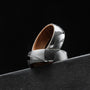 "Sumo Ring", a stylish ring crafted from oak and Damascus, showcasing a modern geometric design.