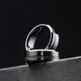 "Sumo Ring", a stylish walnut and ceramic ring, featuring a sleek and modern design.