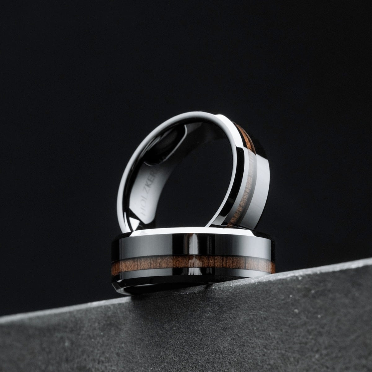 "Sumo Ring", a stylish walnut and ceramic ring, featuring a sleek and modern design.