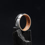 "Sumo Ring" ring with oak interior and Damascus steel exterior, featuring an elegant and modern design.