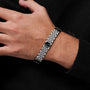 "Pentachord" bracelet in black marble and silver, showcasing elegant and modern style.