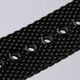 "Comfort Crusher", cintura nera con texture con fori circolari e accenti di design in marmo.