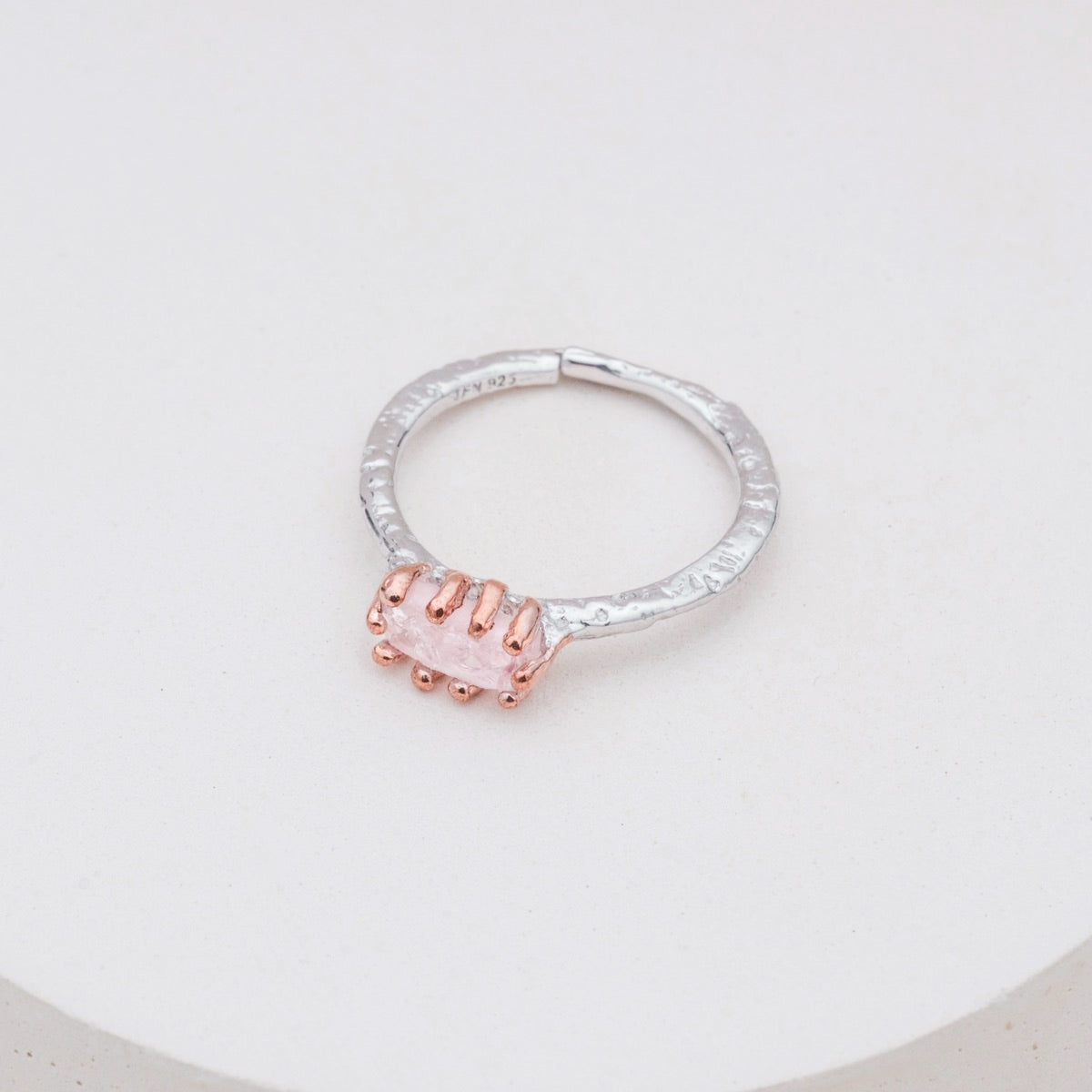 "Silverstream Ring, a stylish rosegold ring featuring rose quartz with a textured silver band."