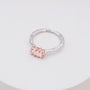 "Silverstream Ring, a stylish rosegold ring featuring rose quartz with a textured silver band."