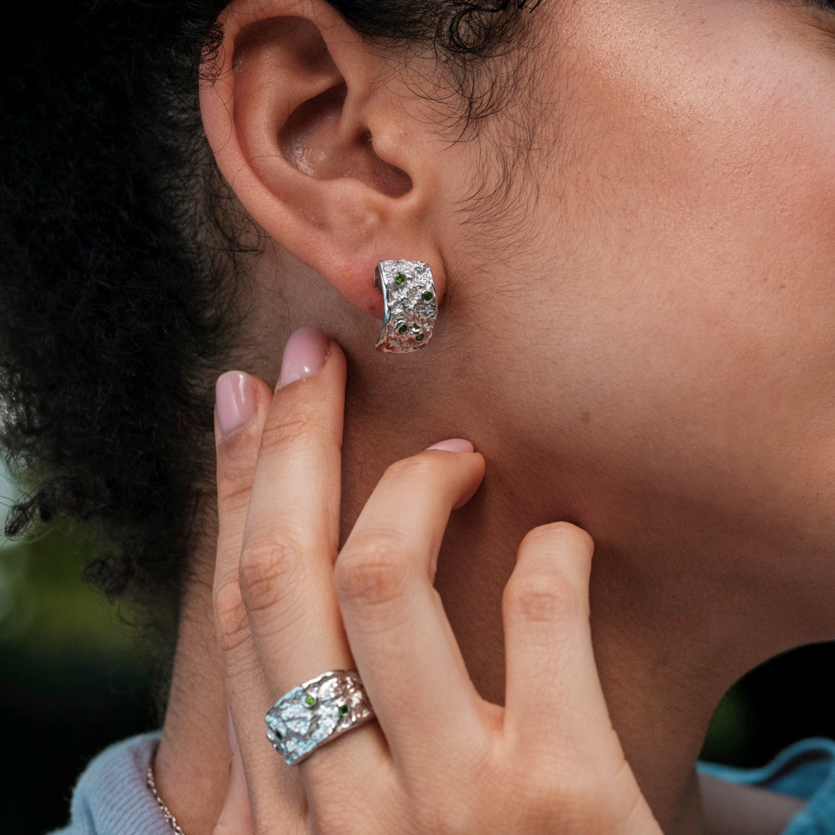 "Silverstream Earrings" earrings, elegantly crafted with diopside and silver, featuring a textured, modern aesthetic.