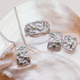 "Silverstream Necklace, a textured silver necklace with diopside accents, exudes a natural elegance and refined style."